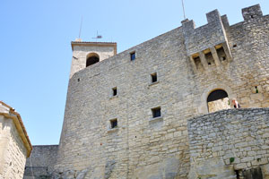 The wall of Guaita fortress has numerous tiny windows in its structure