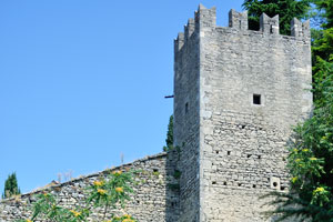 A magnificent corner tower with battlements of the Guaita fortress as seen from Piazzale Cava Antica