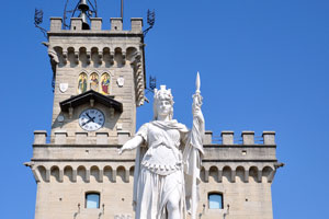 The statue of “Lady of Liberty of San Marino” is in front of the Public Palace