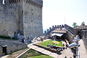 An outdoor medieval scenery is represented inside the fortress of Guaita