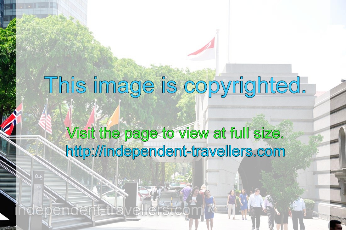 Singaporean flag flies over the entrance to The Fullerton Bay Hotel
