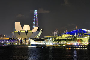 Evening view of the ArtScience Museum, the Singapore Flyer and The Shoppes' at Marina Bay