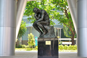 The Thinker (1902) by Auguste Rodin is placed under the NTUC skyscraper