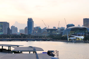 On this Marina Bay evening view you can see Esplanade Bridge in the distance