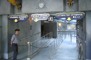 Riders enter the queue from the Sci-Fi City themed area