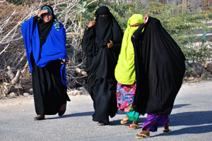 Somali women walk along the road