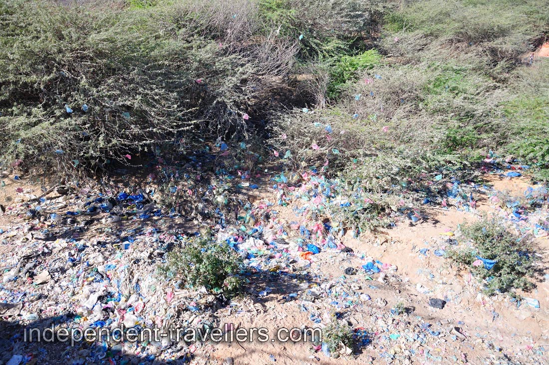 Garbage is abundantly present in the channel of the dry river
