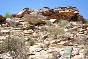 The stairway leads to the complex of caves and rock shelters