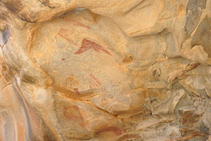 Hundreds of magnificent rock art paintings adorn the walls of several interconnected caves and shelters