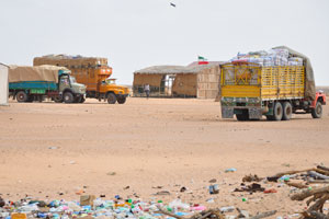 Flag of Somaliland is fluttering in the wind, the garbage and the trucks