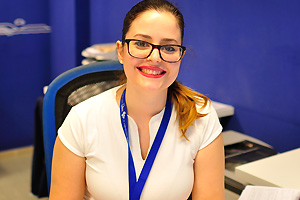 A beautiful female employee is at work in the Canaryfly airline office “IATA: PM” in Gran Canaria Airport “IATA: LPA”