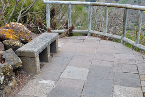 The stone bench is on the viewing platform