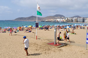 A public beach shower is on the beach of Gran Playa Canteras
