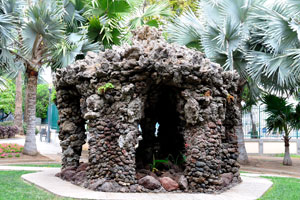 The stone house is surrounded by the Bismarckia palm trees in Doramas Park