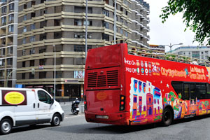 A city sightseeing bus is driving along Avenida de José Mesa y López street