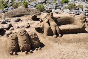 The sand sculptures of Minions creatures are on Maspalomas beach