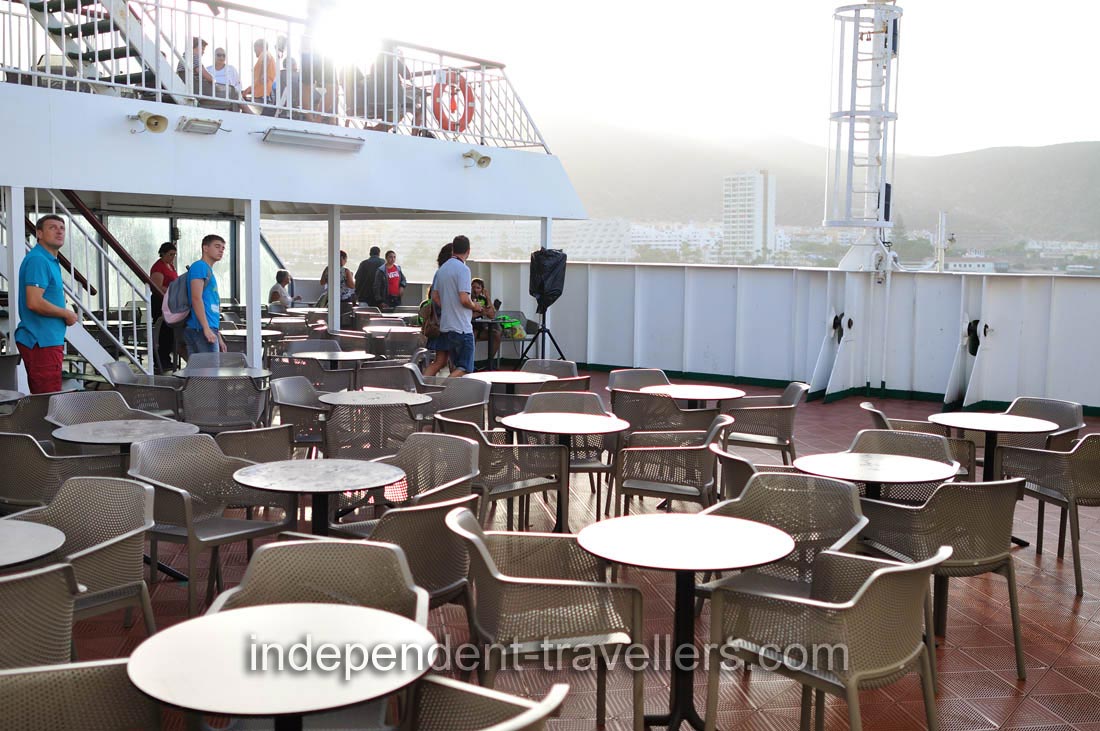 An open air area is filled with the coffee tables on Volcán de Taburiente ferry