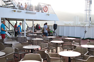 An open air area is filled with the coffee tables on Volcán de Taburiente ferry