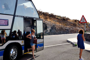 Tourists get off the bus on the first observation deck