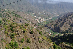 A deep narrow valley with steep rocky sides