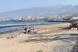 Playa de las Américas beach is on the background of mountains