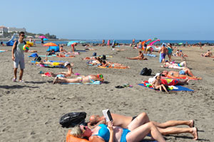 Many tourists prefer to relax on Playa de Troya beach without any sun loungers and parasols