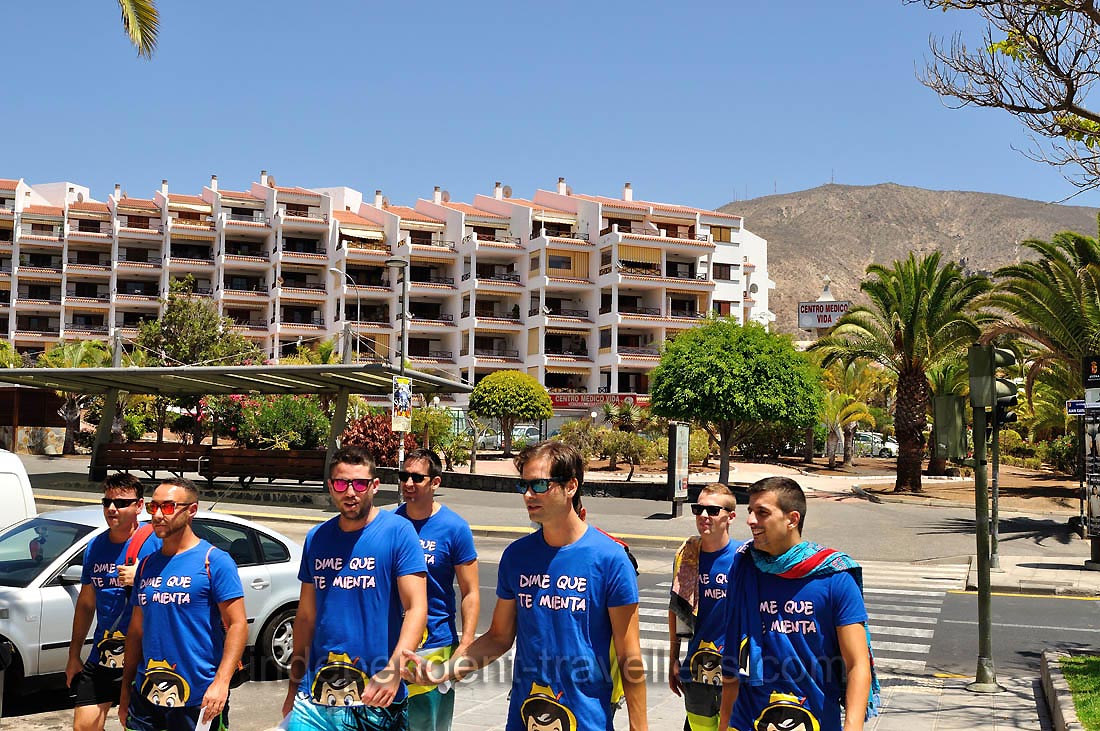A group of young men is crossing Avenida de Juan Carlos I