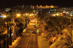 The city of Los Cristianos at night as seen from the footbridge which spans across Avenida de Chayofita street