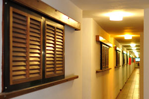 A long corridor is inside the “San Marino Holidays” apartment complex