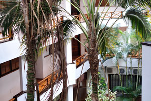 The interior of “San Marino Holidays” apartment complex is filled with exotic plants