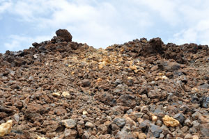 The enormous hills of colourful volcanic lava surround the trail #12 “Pico Viejo Vantage Point”