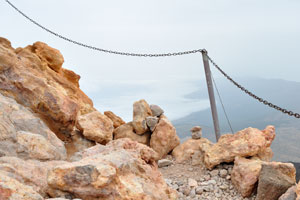This metallic chain serves as a defense barrier for tourists walking along the edge of Mount Teide crater