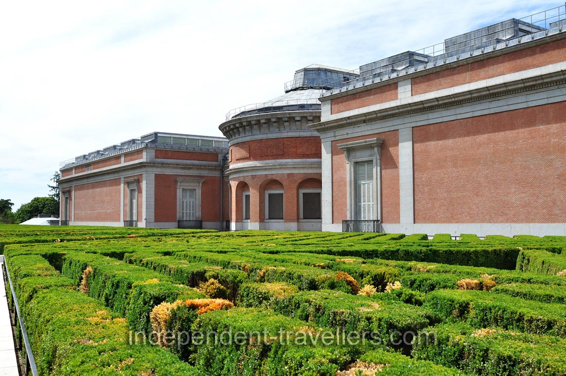 Low beautiful bushy hedges surround the Prado Museum