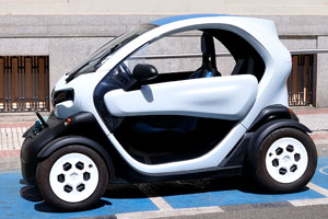 The Renault Twizy is charging at a carsharing station on Calle de Ibiza #1, it is close to the eastern wall of the park