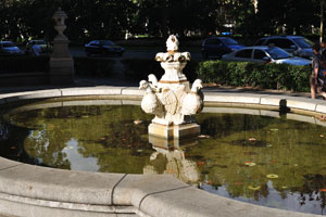 This fountain is located close to the intersection between Paseo del Prado and Calle de Montalbán, near the entrance to the Naval Museum of Madrid