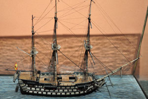 This ship model is placed under the portrait of Charles IV of Spain