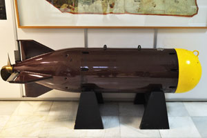 A brown heavy rotund torpedo is on display at the museum