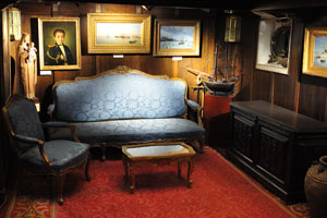 Antique furniture is placed inside the Chief-commander's cabin