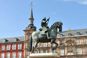 A soap bubble flies above the equestrian statue of Philip III