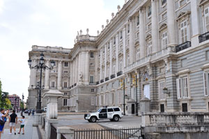 Spanish Royal Guard jeep is parked beside the Royal Palace of Madrid
