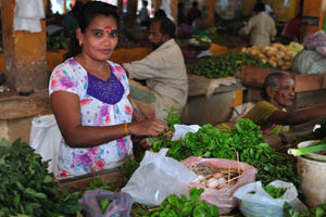 A female vendor of greenery