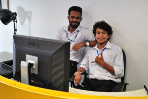 Two young Sri Lankan men work in the department