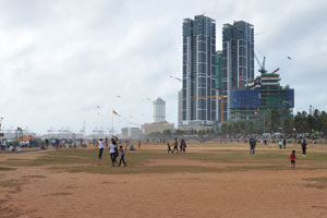 An open area is full of flying kites any time of the day
