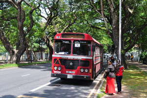 A bus #120 has stopped at Campus Bus Stop on Thurstan Road