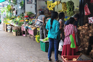 Bananas and coconuts are for sale at Nugegoda Market