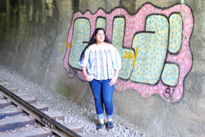 A girl is in the railway tunnel