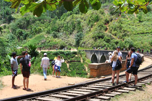 Tourists gathered at the railway track after a train left the bridge