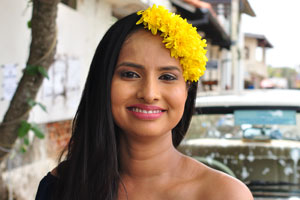A gorgeous Sri Lankan lady with a yellow wreath on her head