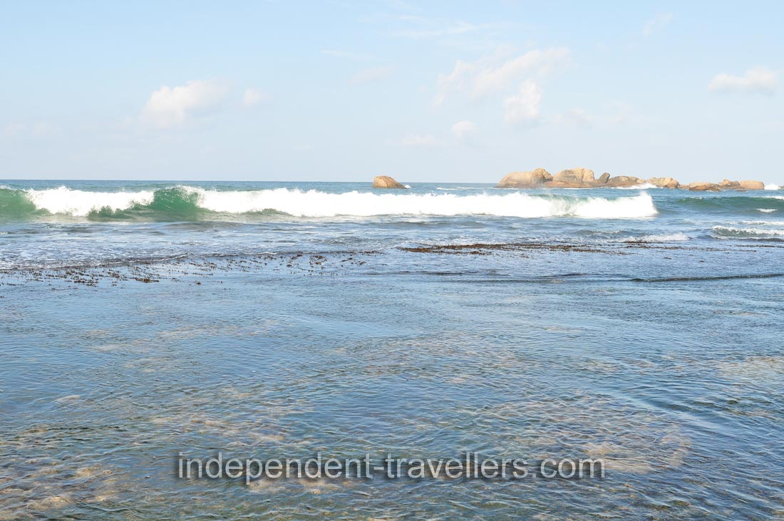 It could be dangerous to walk deep in the water on Hikkaduwa Beach