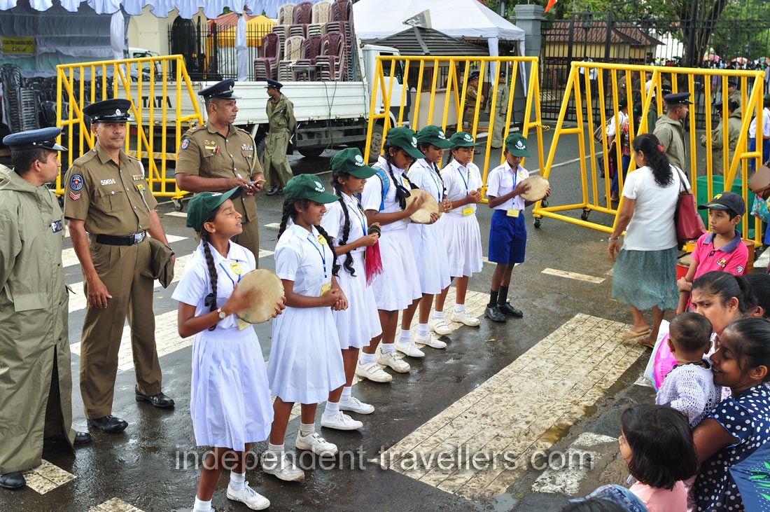 A school dance group performs with drums